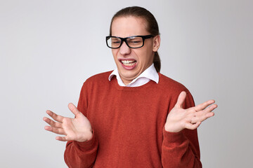portrait of disgusted man in glasses and shirt