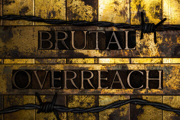 Brutal Overreach text message on grunge textured gold and copper background