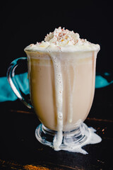 White Chocolate Latte Topped with Whipped Cream and Cocoa Powder: A sweet coffee drink made with white chocolate and whipped cream
