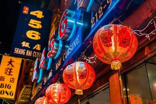 New York City, New York, USA - July 31, 2016: Chinatown at night with paper lanterns and neon signs.
