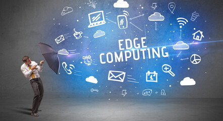 Businessman defending with umbrella, modern technology concept