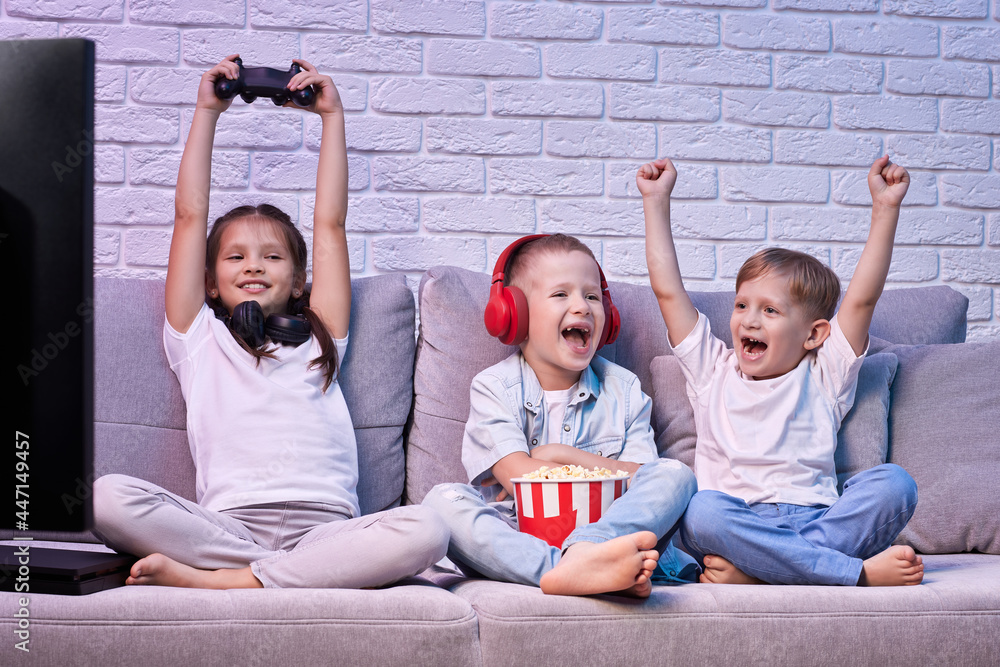 Wall mural children playing video game with game console