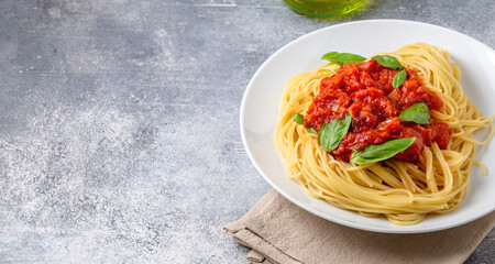 Pasta al pomodoro. Spaghetti with fresh tomato sauce and basil. With space for text