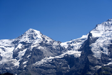Jungfraujoch with research station Sphinx at Bernese highland on a sunny summer day with blue sky...