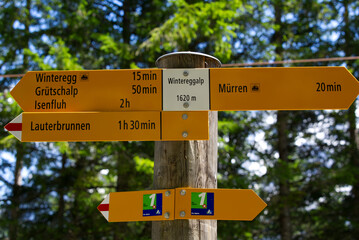 Mountain peak Eiger at Bernese highland on a sunny summer day with blue sky background and clouds in the foreground. Photo taken July 20th, 2021, Lauterbrunnen, Switzerland.