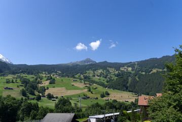 Obraz premium Landscape in the mountains at Bernese highland on a beautiful summe day. Photo taken July 20th, 2021, Lauterbrunnen, Switzerland.