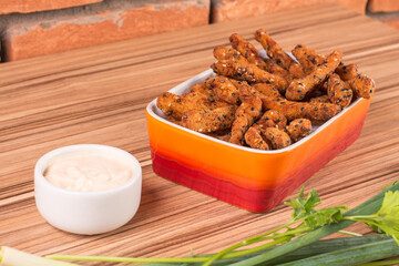 fried chicken on orange platter on wooden background