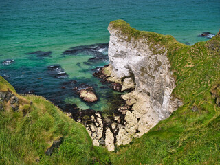 Coastal cliffs showing exposed strata near Portrush on the Antrim Causeway Coast Path - these rocks...
