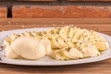 portion of cheese on wooden background
