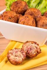 portion of dried meat dumpling on wooden background