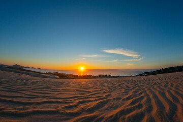 Fototapeta na wymiar sunrise on the beach and dune
