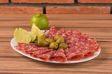portion of salami on wooden background