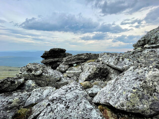 Fototapeta na wymiar Stones on the top of Mount Otorten (1234 meters). Russia, Northern Urals