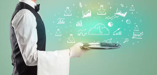 Handsome young waiter in tuxedo holding money icons on tray