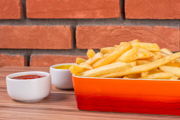 portion of potato chips on wooden background