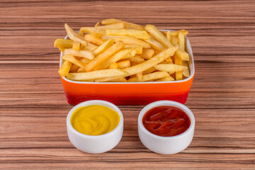 portion of potato chips on wooden background