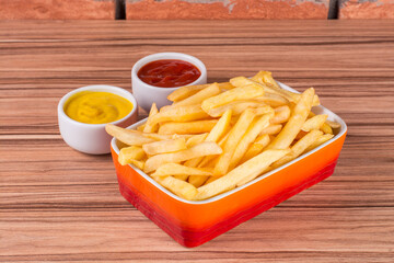 portion of potato chips on wooden background