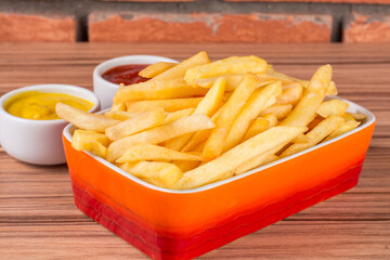 portion of potato chips on wooden background