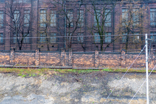 Old, coal power plant in Szombierki district in Bytom, Silesia, Poland. Wall surrounding the building and wall detail.