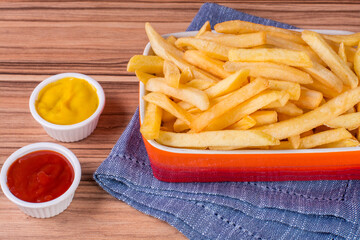 portion of potato chips on wooden background