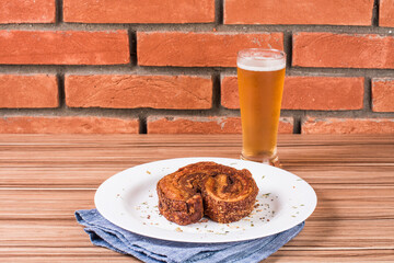 portion of pork cracklings on wooden background