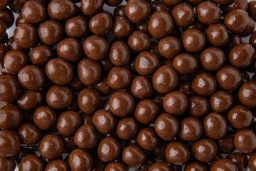 Hazelnuts in milk chocolate, dragee. Desserts for Candybar. Small round candies.