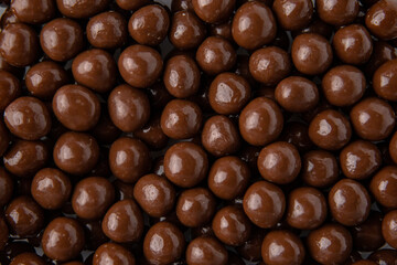Hazelnuts in milk chocolate, dragee. Desserts for Candybar. Small round candies.