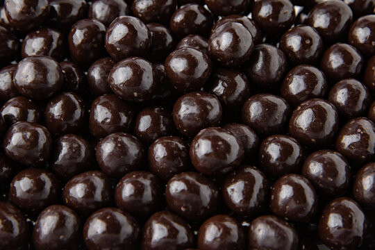 Hazelnuts in dark chocolate, dragees. Desserts for Candybar. Small round candies.