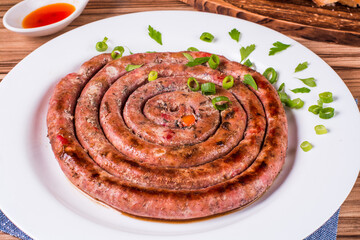 sausage portion with wood and brick background