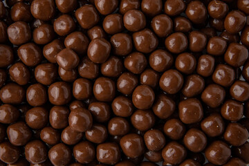 Hazelnuts in milk chocolate, dragee. Desserts for Candybar. Small round candies.