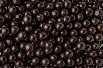 Hazelnuts in dark chocolate, dragees. Desserts for Candybar. Small round candies.