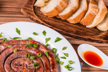 sausage portion with wood and brick background