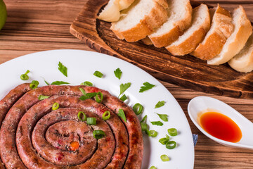 sausage portion with wood and brick background