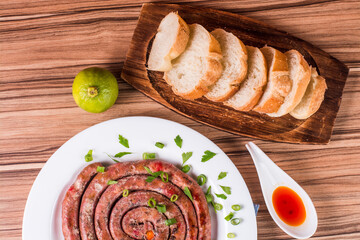sausage portion with wood and brick background