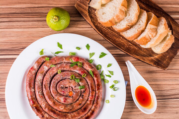 sausage portion with wood and brick background