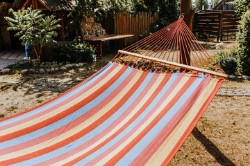 Summer garden with hanging hammock for relaxation