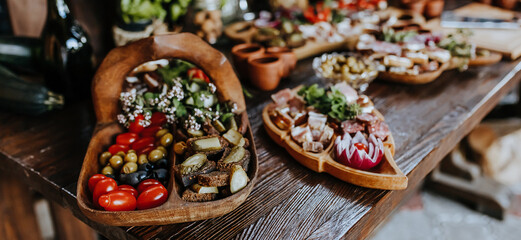 Beautifully decorated snacks on the banquet table before the holiday. Catering food and drink on wedding party