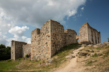 Fototapeta na wymiar Ruins of an old castle against a blue sky