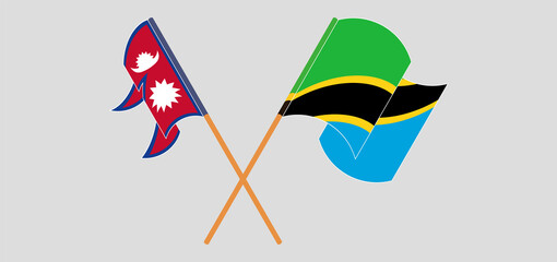 Crossed and waving flags of Nepal and Tanzania