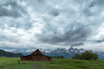 Fototapeta premium Mormon Row in Jackson Hole, Wyoming on a partially cloudy day