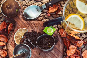 Morning tea with liptone where dried lime that can be mixed with tea is on the table.