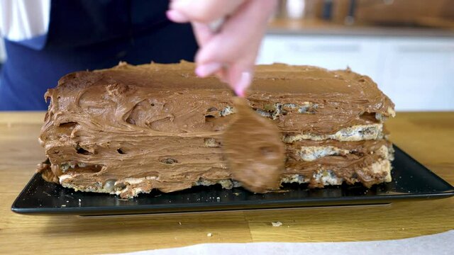 The process of making a chocolate tort with nuts and cream. cooking at home.