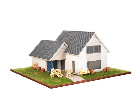 Miniature house with garden furniture