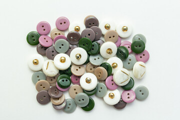 collection of buttons, beautiful buttons for clothes. Pink, green, white