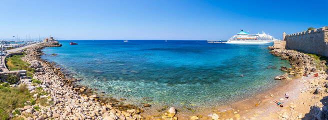 Panoramic view of beach, harbor and marina from Saint Paul's Gate of ancient city. Mooring yachts...