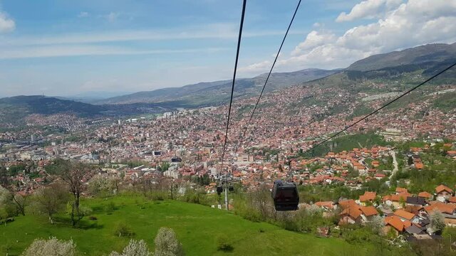 Sarajevo Cable Car, City in background, raising - (4K)