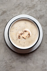 Cream of mushroom soup on grey background. Vegetarian food