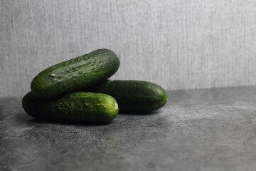 a pile of cucumbers isolaed on gray background