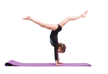 Cute child girl making Gymnastic exercises against white.