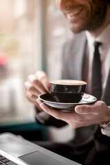 Morning cappuccino with latte art, elegant black cup